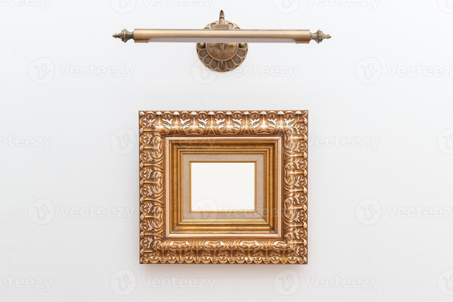 art display with touch of luxury using ornate gold frames. The gilded antique design adds elegance and retro charm to setting. The empty frames provide a blank canvas to showcase pictures or artwork. photo