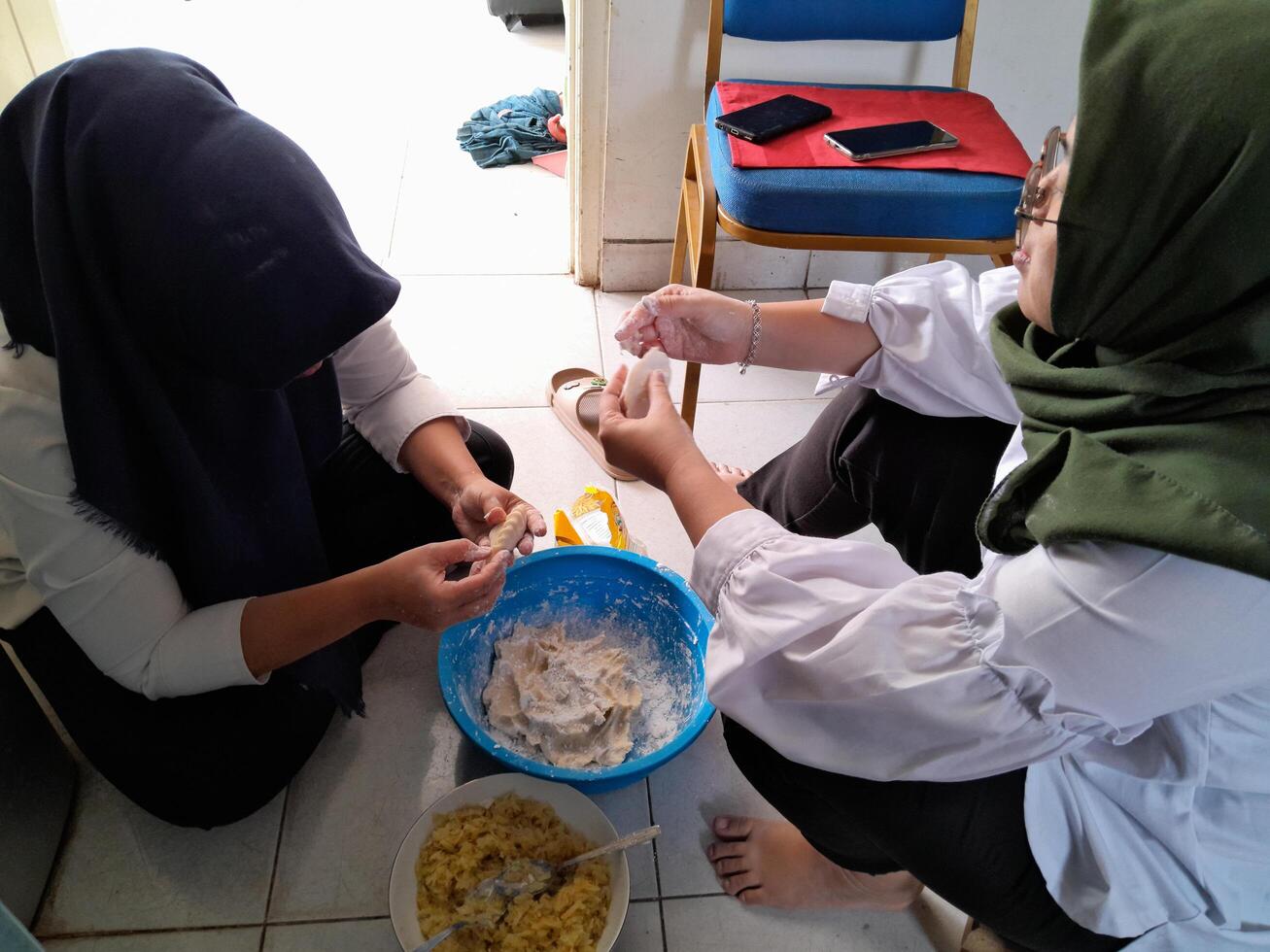 Photograph of women making a cake. Perfect for magazines, newspapers, tabloids photo