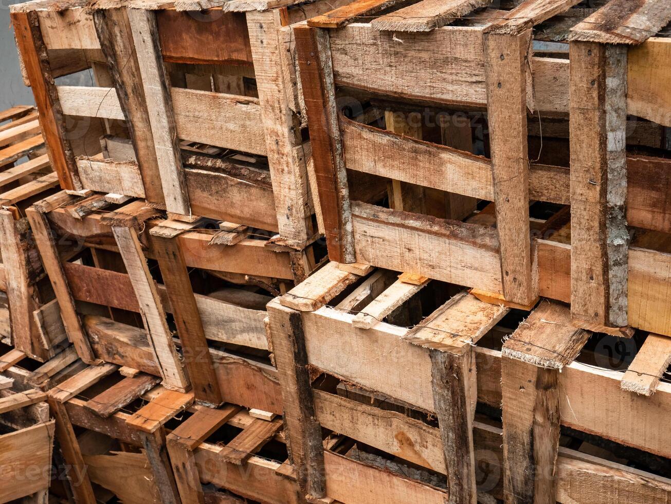 piles of empty wooden boxes in traditional markets photo