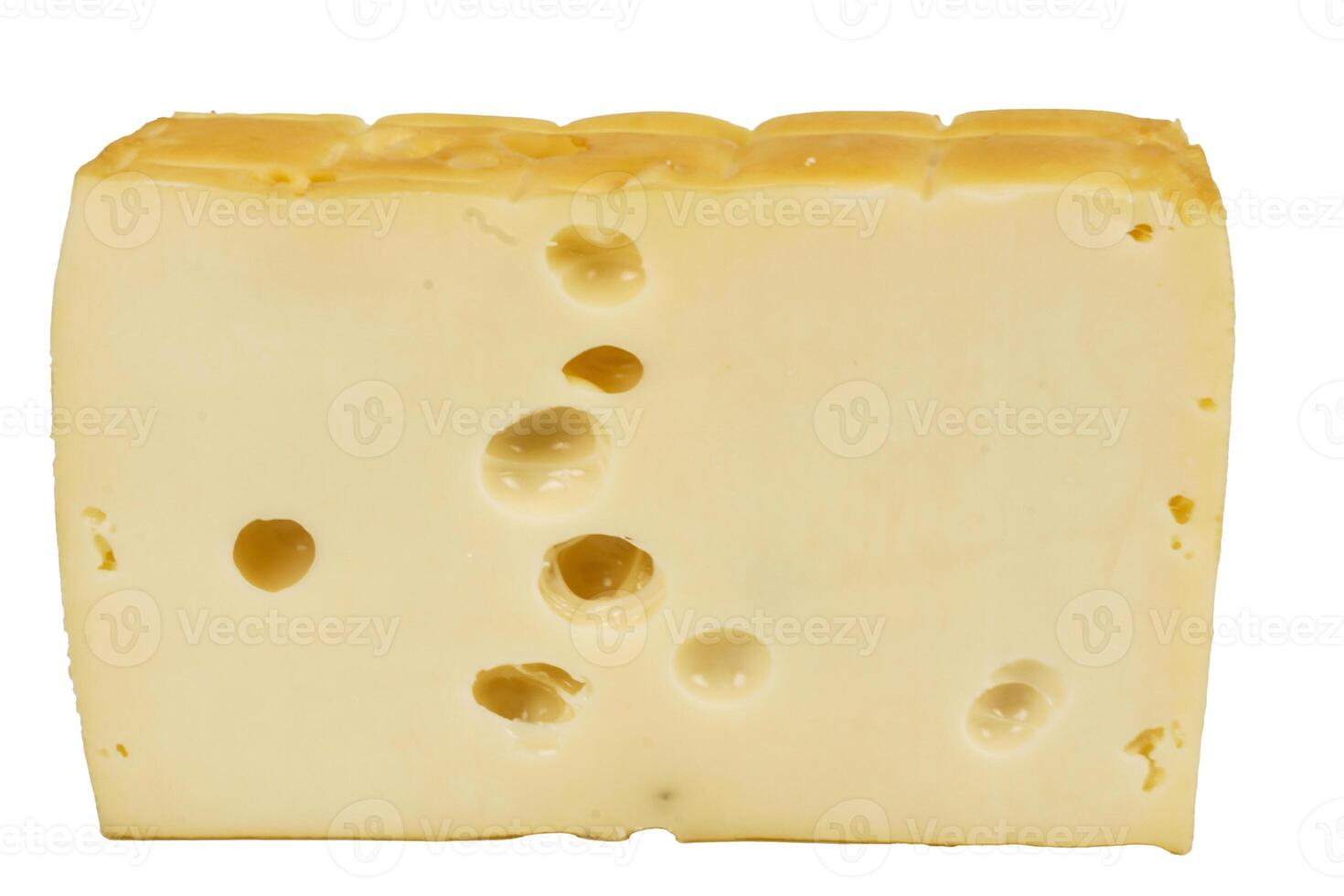 Perforated yellow cheese. Big piece of cheese. photo