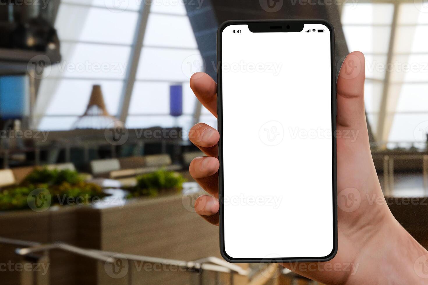 Smartphone mockup in a hand holding it with urban business environment photo