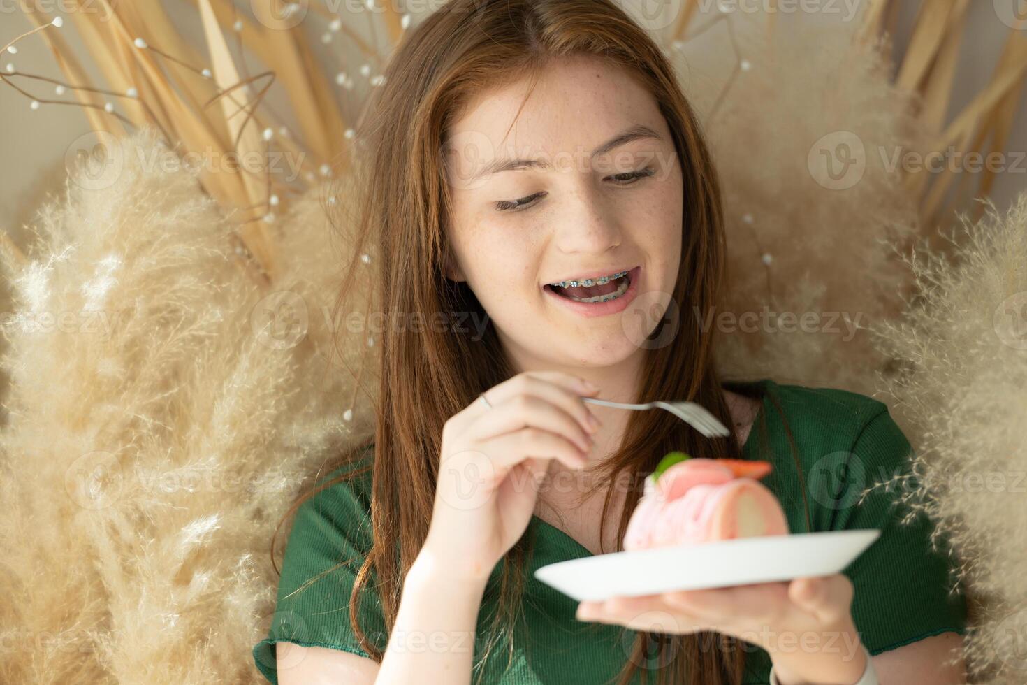 Portrait of Teenage girl with braces in picture frame photo