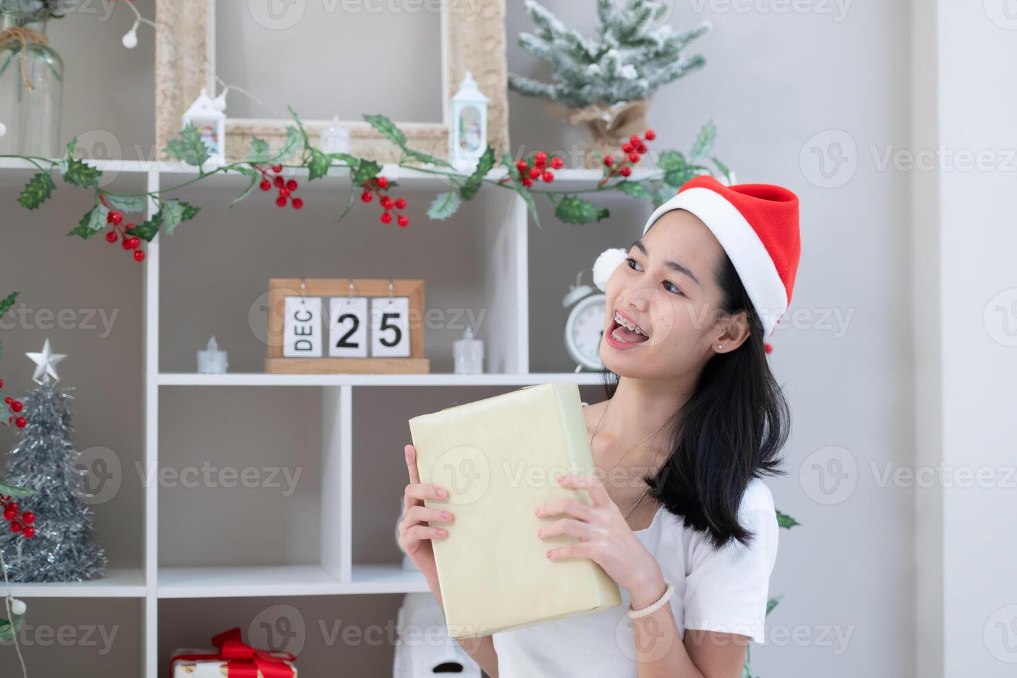 Portrait of Teenage girl with Christmas gift box. photo