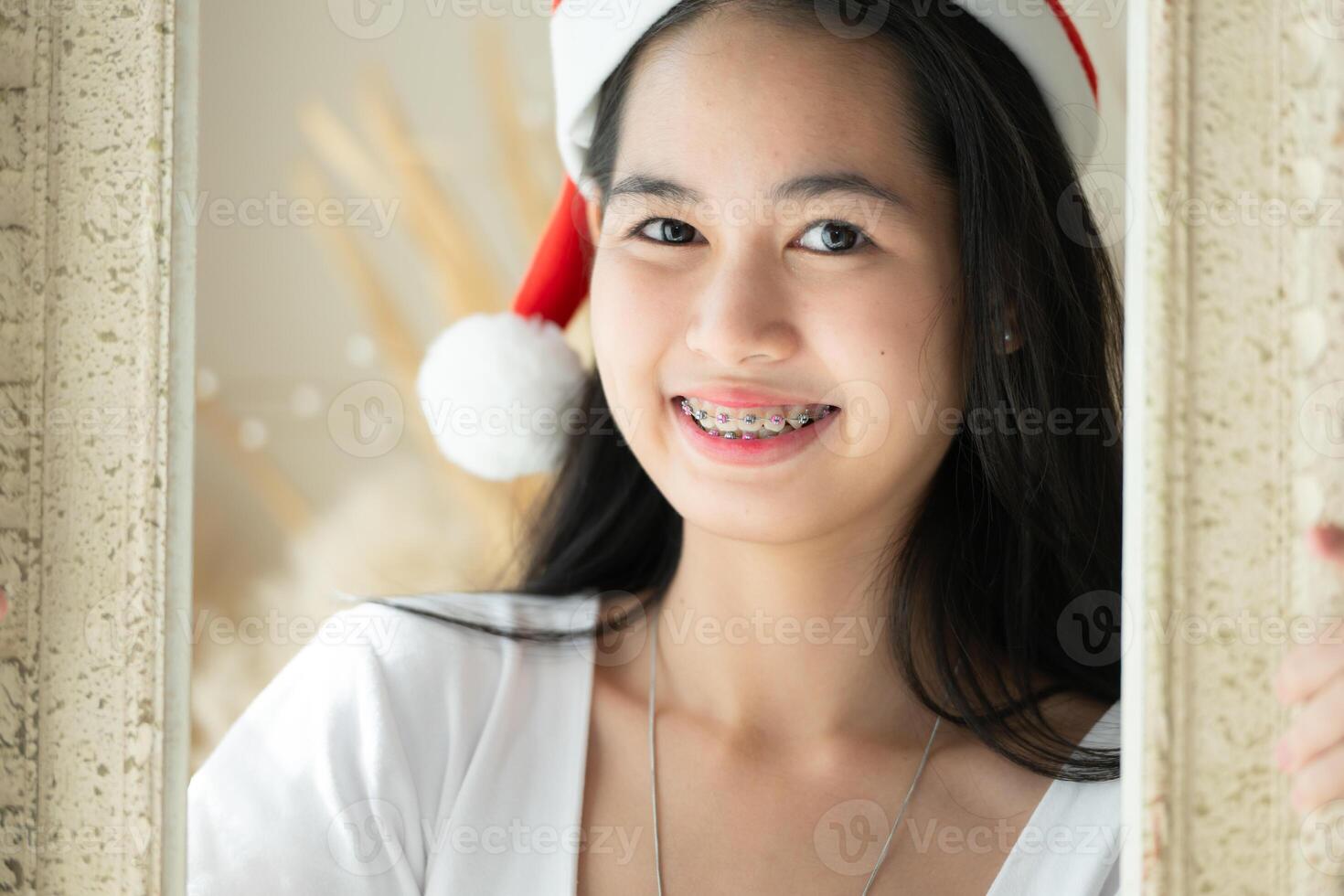 Portrait of Teenage girl with braces in picture frame photo