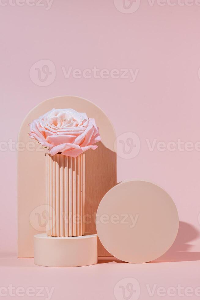 Pink background for product presentation with concrete podiums of geometric shapes. Empty podiums. Mockup. photo