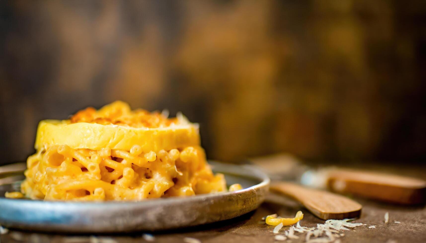 AI generated Copy Space image of warm and delicious homemade baked schotel macaroni on a wooden photo