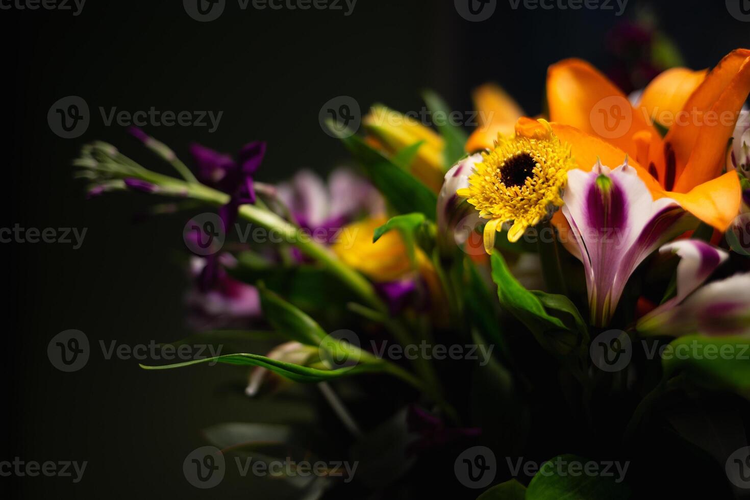 Still life. luxury spring flowers on a black background. color bloom. Low key photo