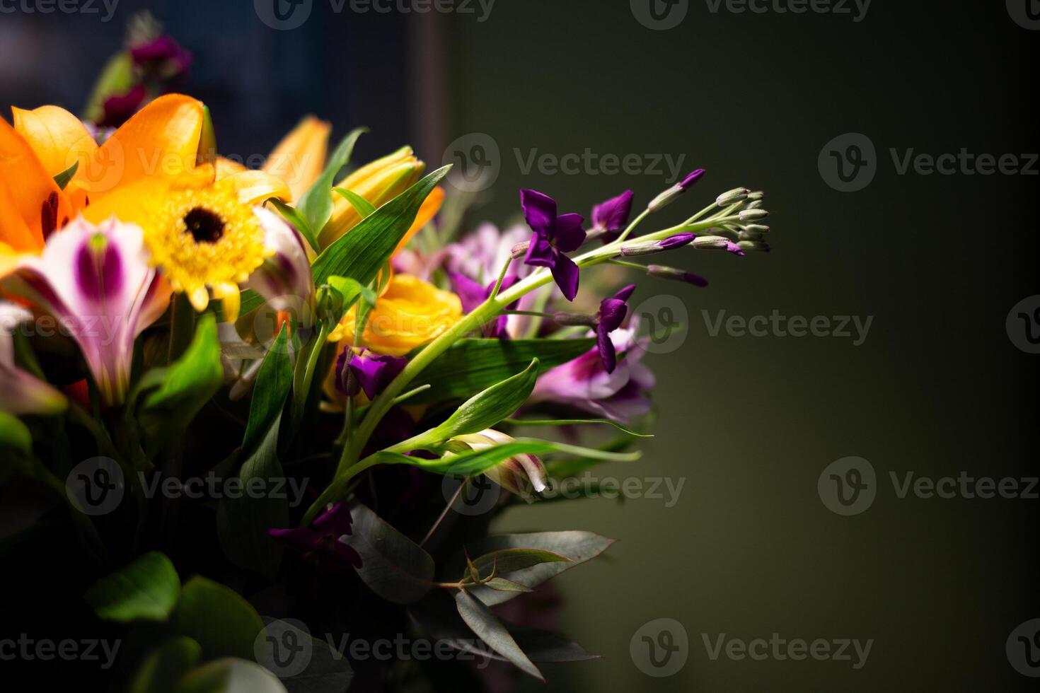 Still life. luxury spring flowers on a black background. color bloom. Low key photo