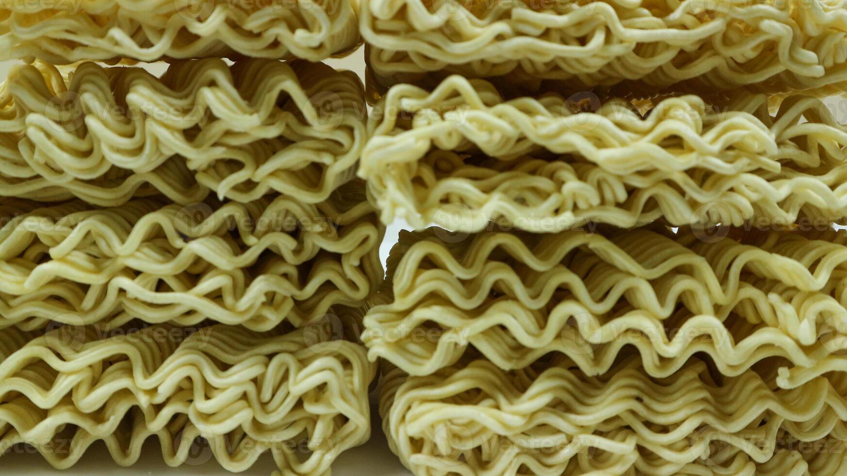 Textured dried Instant noodles, isolated on white background photo