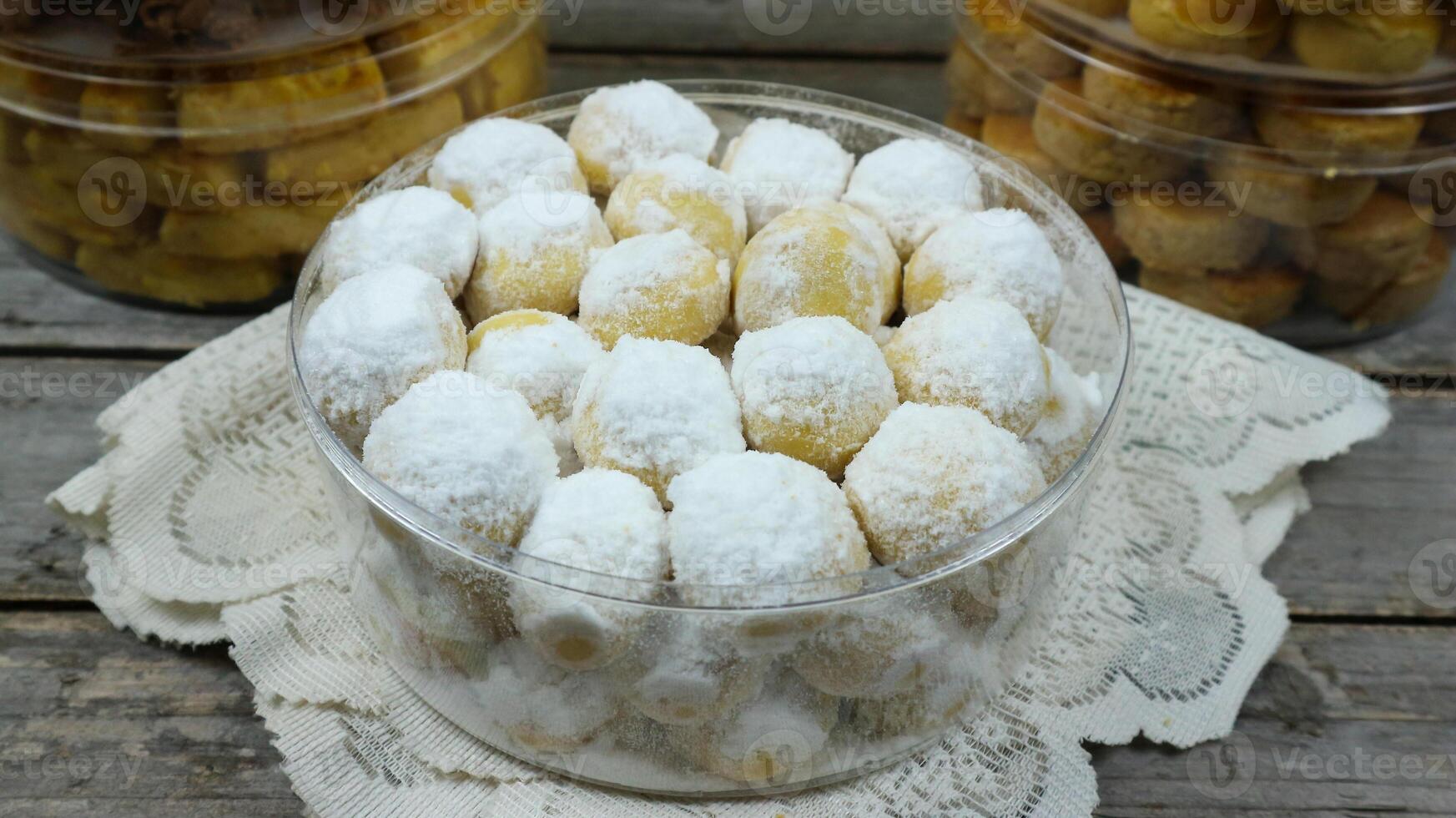 Kue putri salju or Snow White Cookies is a cookies that sprinkled with icing sugar photo