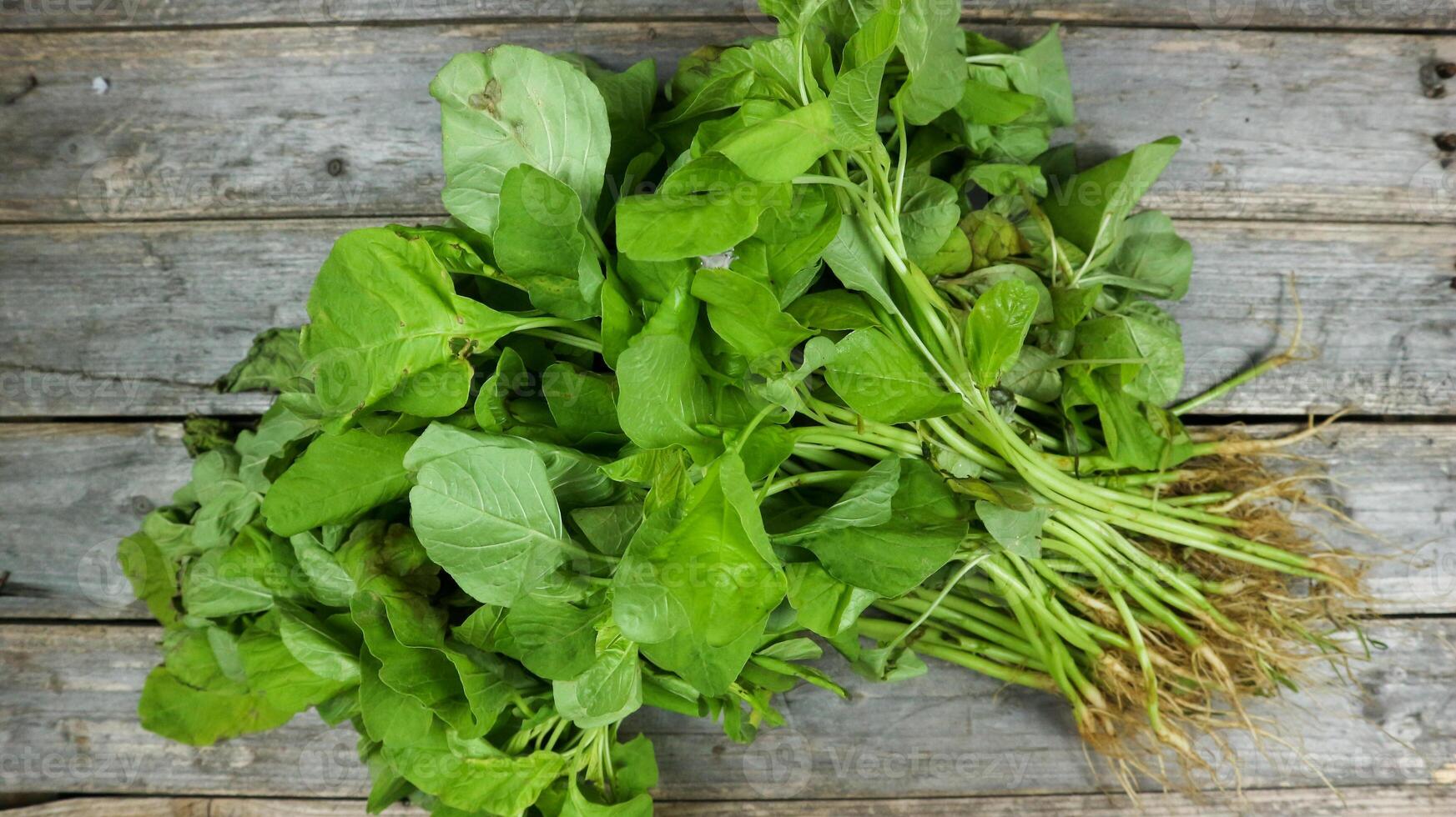 Fresh spinach vegetable on the grey table. photo