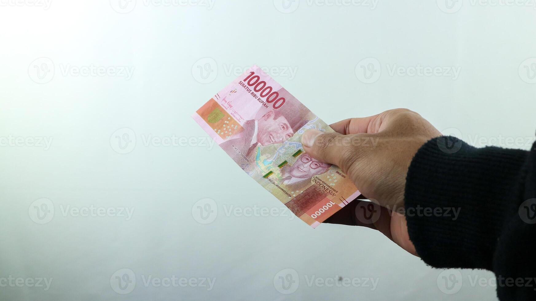 Hand hold money rupiah,transaction concept, financial concept photo