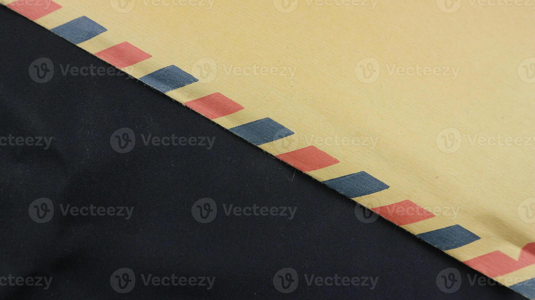 brown envelope on black background. Brown envelope front and back isolated on black background. Letter top view. Object with clipping path photo