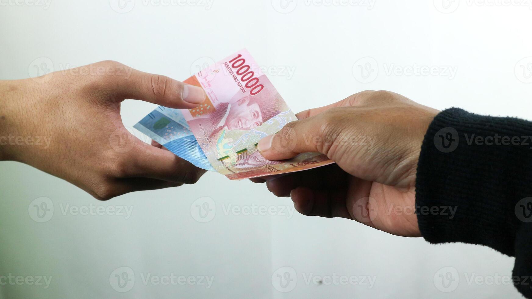 Hand hold money rupiah,transaction concept, financial concept photo