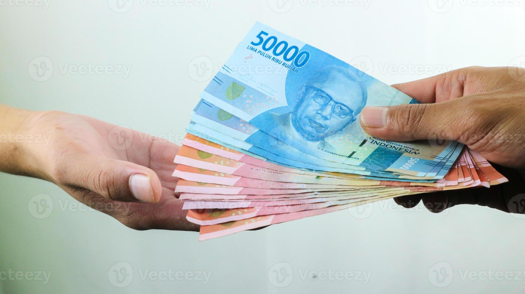 Hand hold money rupiah,transaction concept, financial concept photo