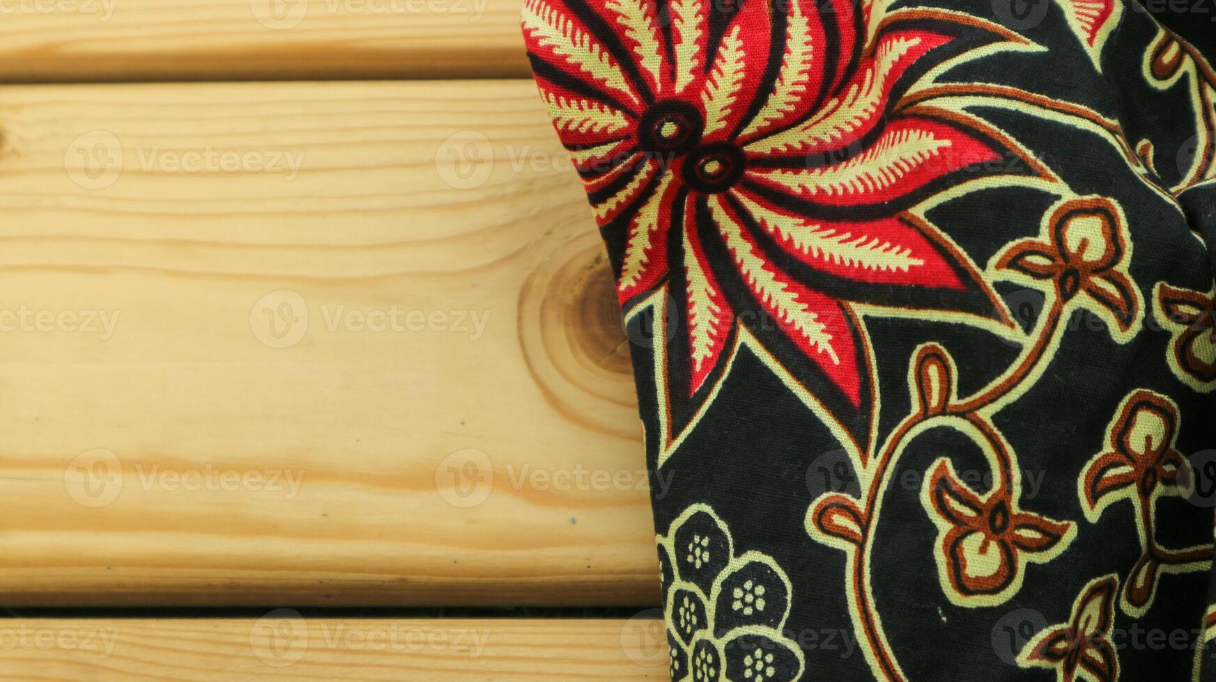 A traditional Indonesian fabric, namely batik cloth which has unique and different patterns and image motifs for each region. Cultural theme photos, typical of Asia. photo