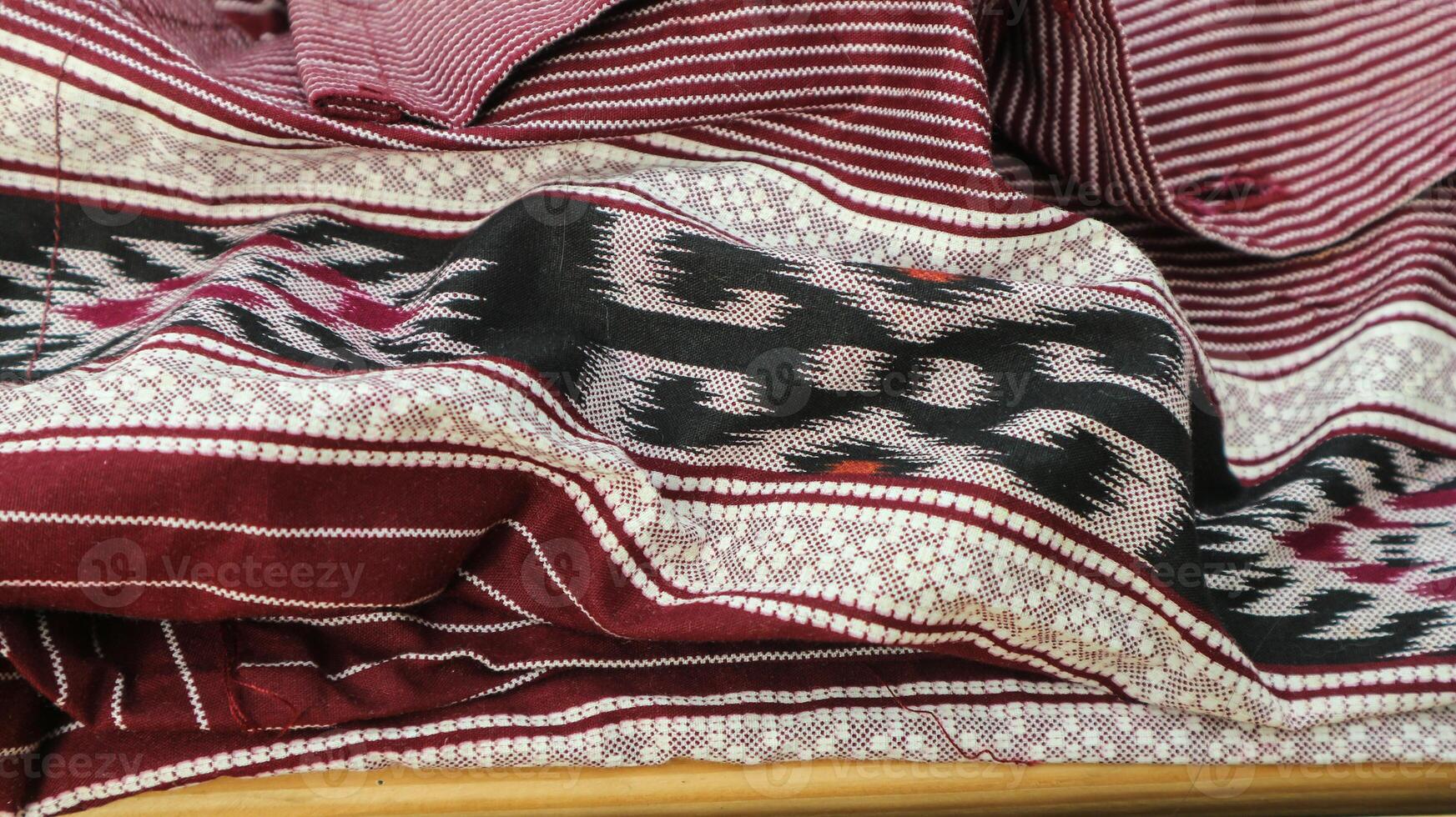 A traditional Indonesian fabric, namely batik cloth which has unique and different patterns and image motifs for each region. Cultural theme photos, typical of Asia. photo