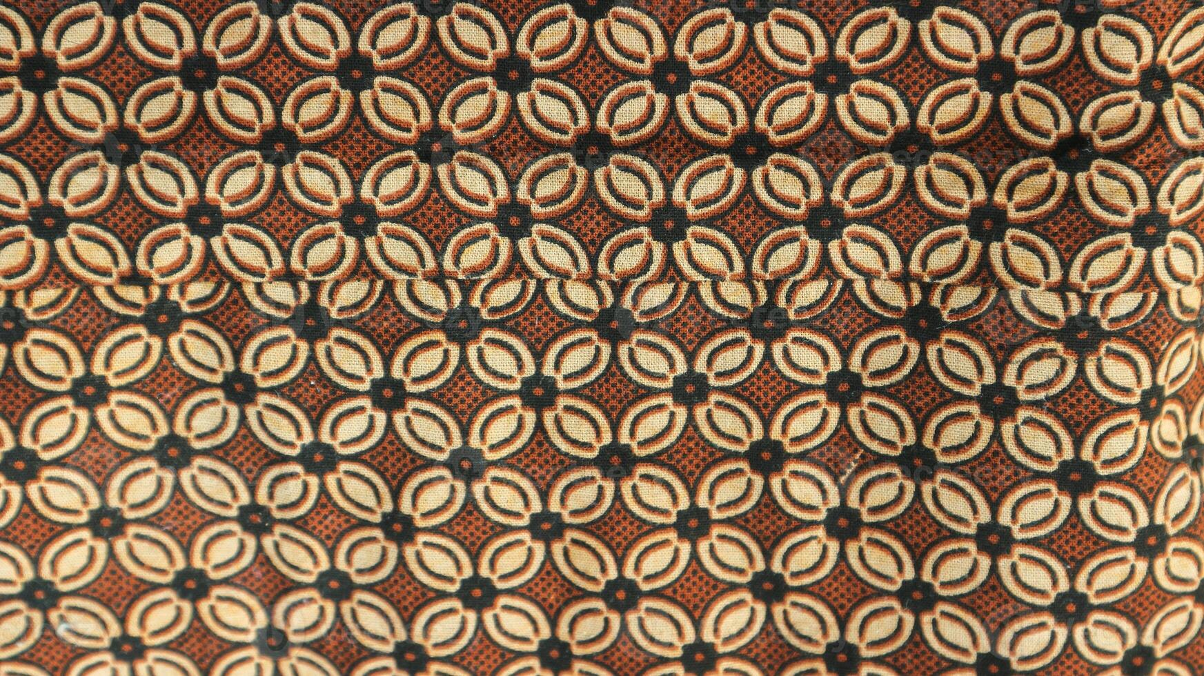 A traditional Indonesian fabric, namely batik cloth which has unique and different patterns and image motifs for each region. Cultural theme photos, typical of Asia. photo