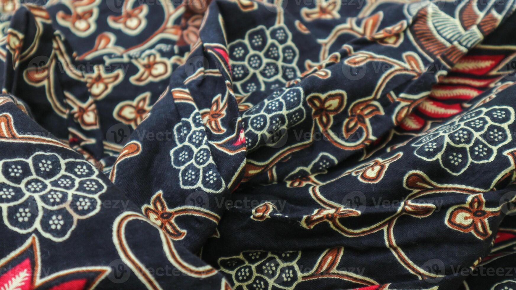 A traditional Indonesian fabric, namely batik cloth which has unique and different patterns and image motifs for each region. Cultural theme photos, typical of Asia. photo