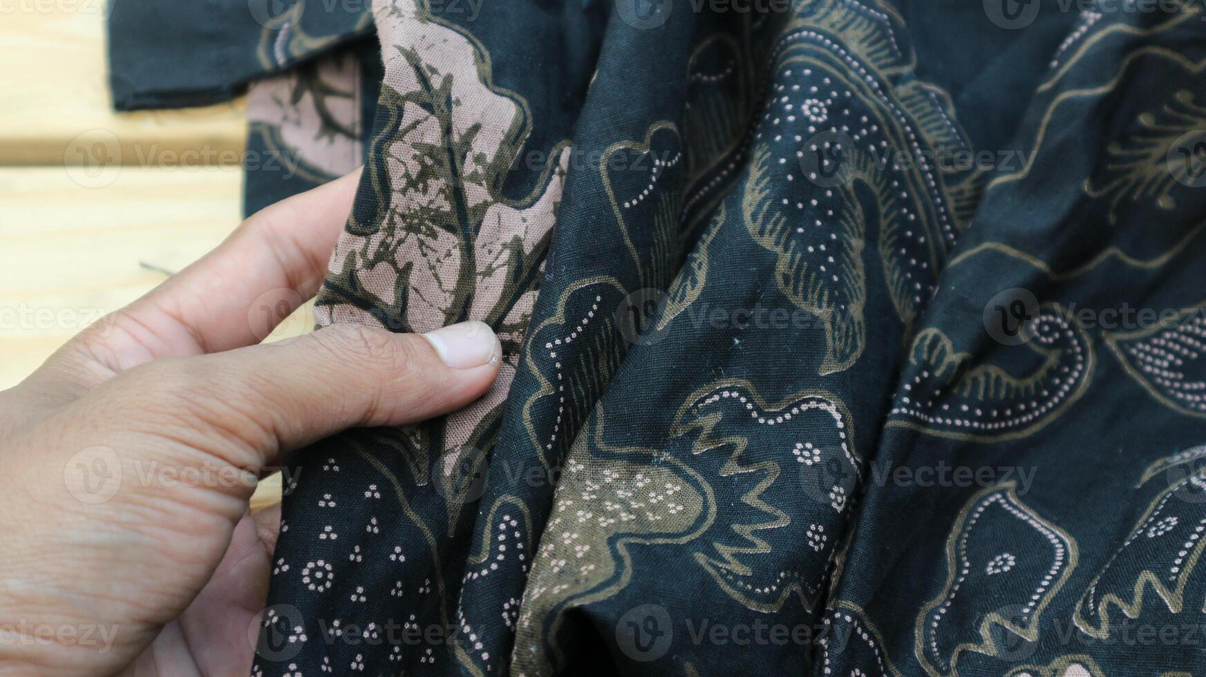 A traditional Indonesian fabric, namely batik cloth which has unique and different patterns and image motifs for each region. Cultural theme photos, typical of Asia. photo