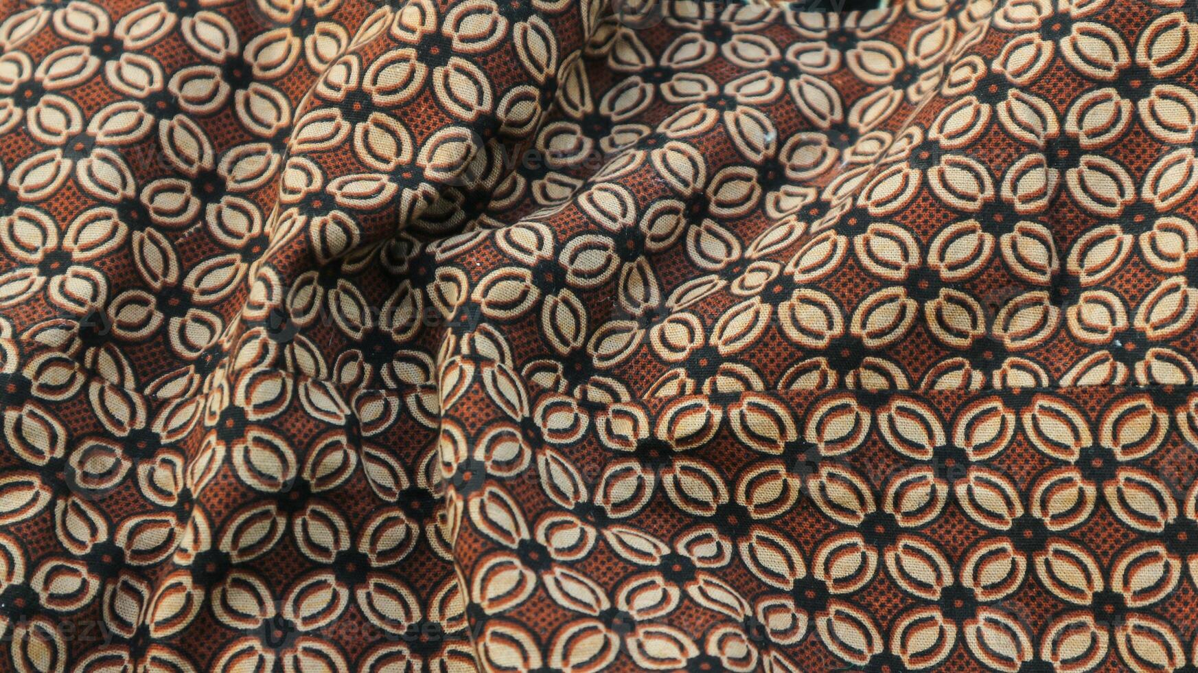 A traditional Indonesian fabric, namely batik cloth which has unique and different patterns and image motifs for each region. Cultural theme photos, typical of Asia. photo