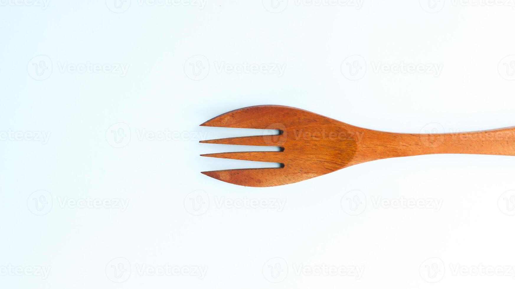 Wooden spoon and fork isolated on white background. Kitchen and cooking concept. photo
