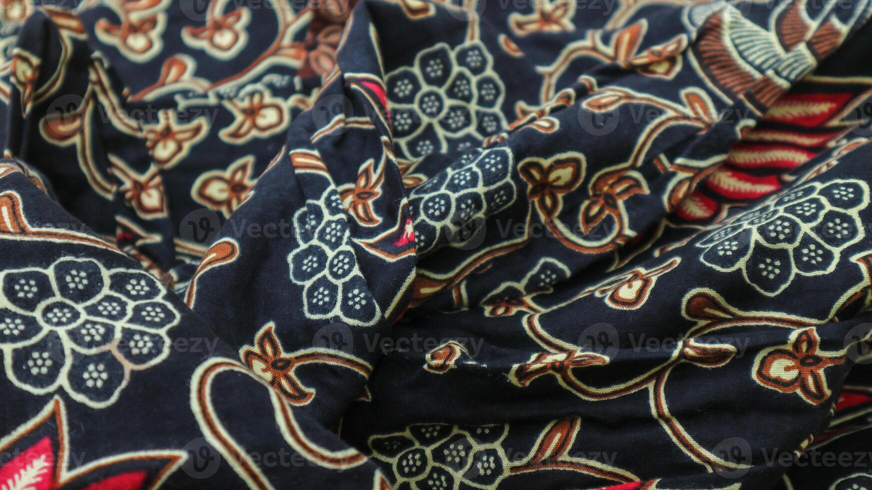 A traditional Indonesian fabric, namely batik cloth which has unique and different patterns and image motifs for each region. Cultural theme photos, typical of Asia. photo