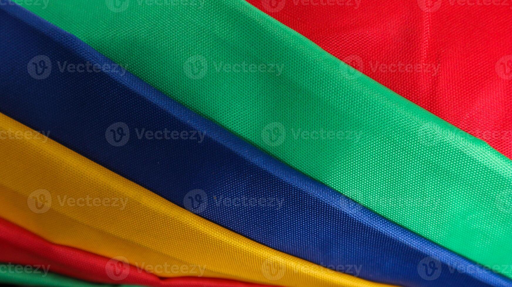 Soft Velvet Piece of Fabric with Folds in rainbow color to be used as background or overlay.Rainbow background. Rainbow flag, LGBT flag, gay flag. photo