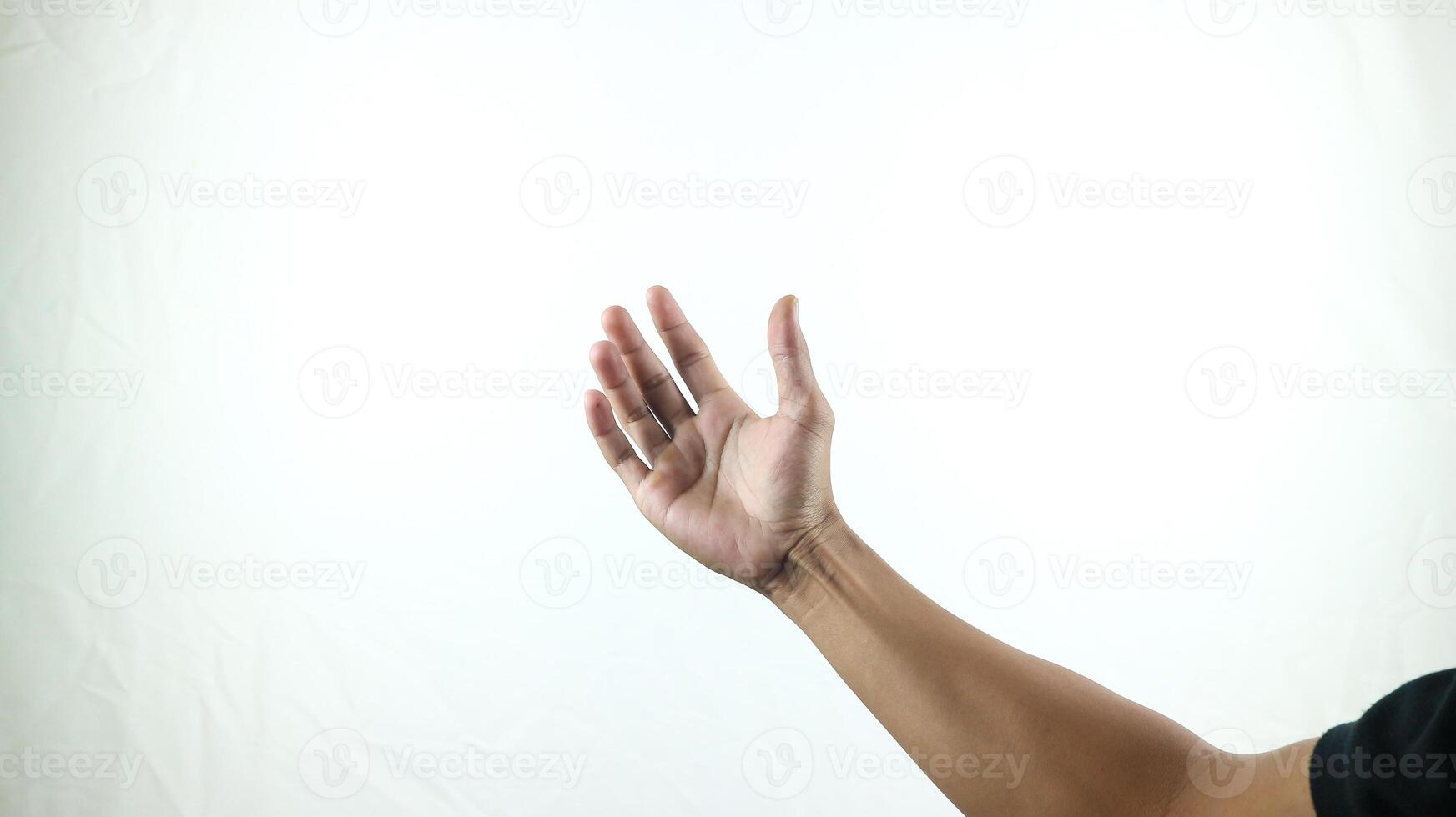 hand holding something like a bottle or smartphone on a white background photo