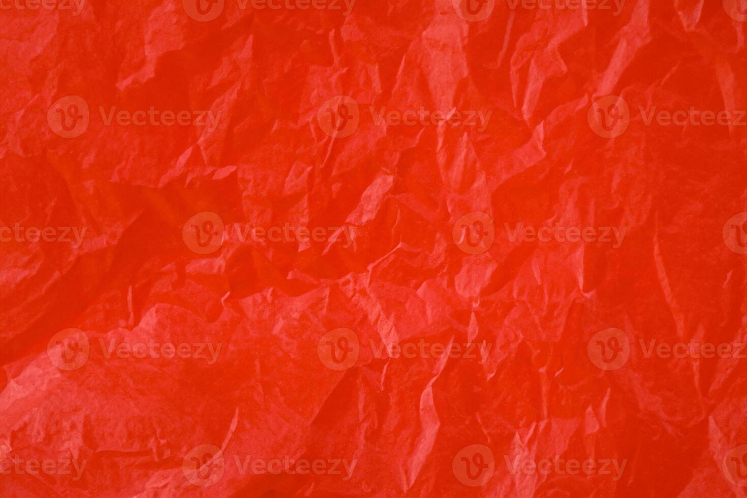 Red crumpled paper texture photo