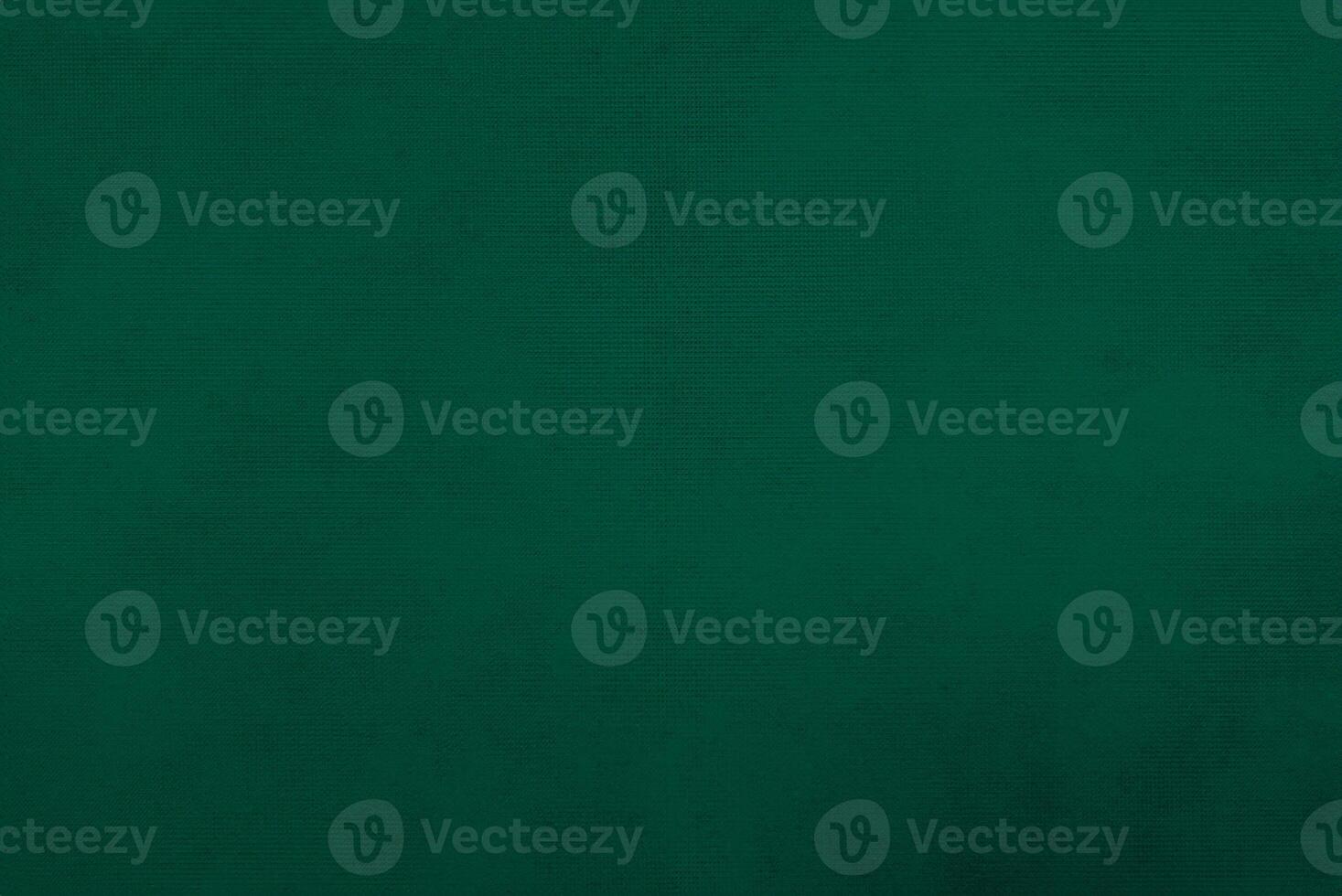 Dark green old velvet fabric texture used as background. Empty green fabric background of soft and smooth textile material. There is space for text... photo