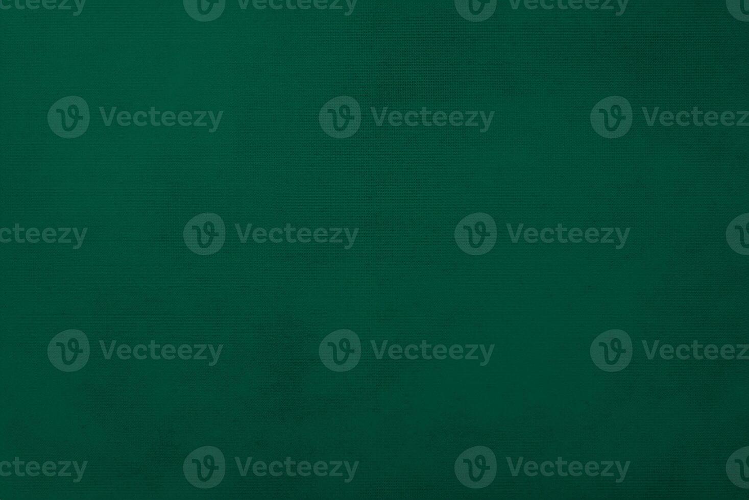 Dark green old velvet fabric texture used as background. Empty green fabric background of soft and smooth textile material. There is space for text... photo