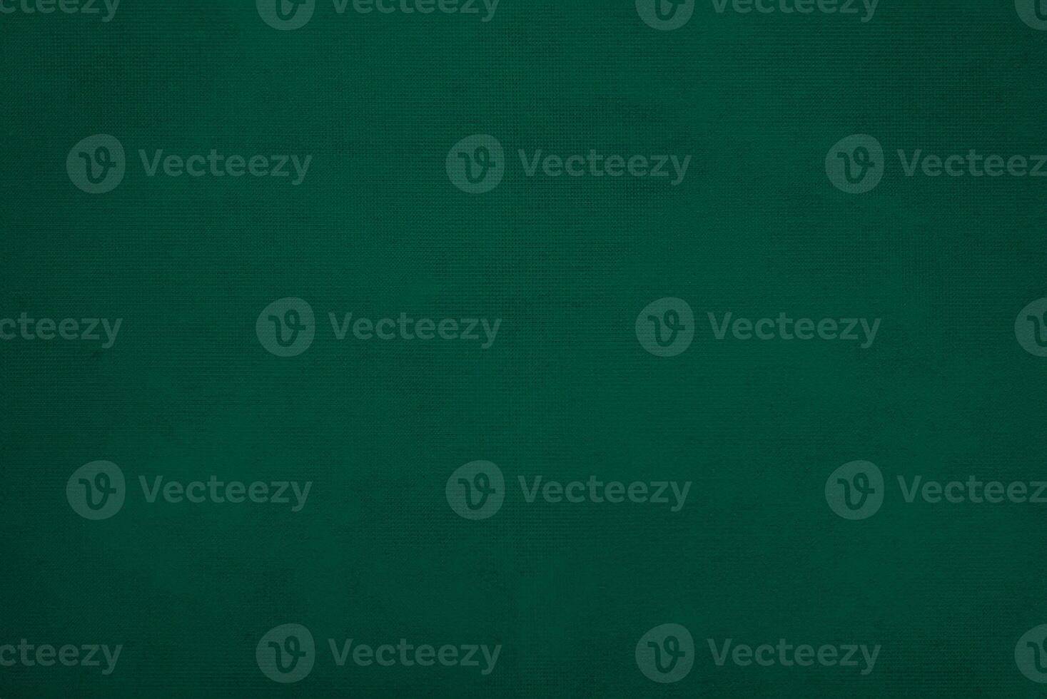 Dark green old velvet fabric texture used as background. Empty green fabric background of soft and smooth textile material. There is space for text... photo