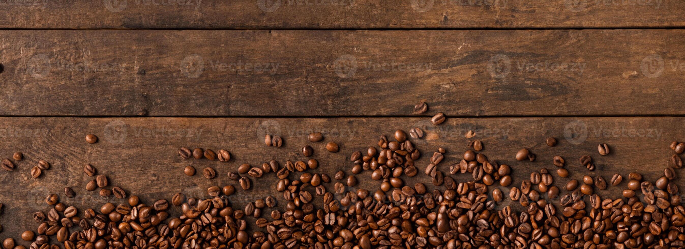 Coffee beans on wooden background with copyspace. photo