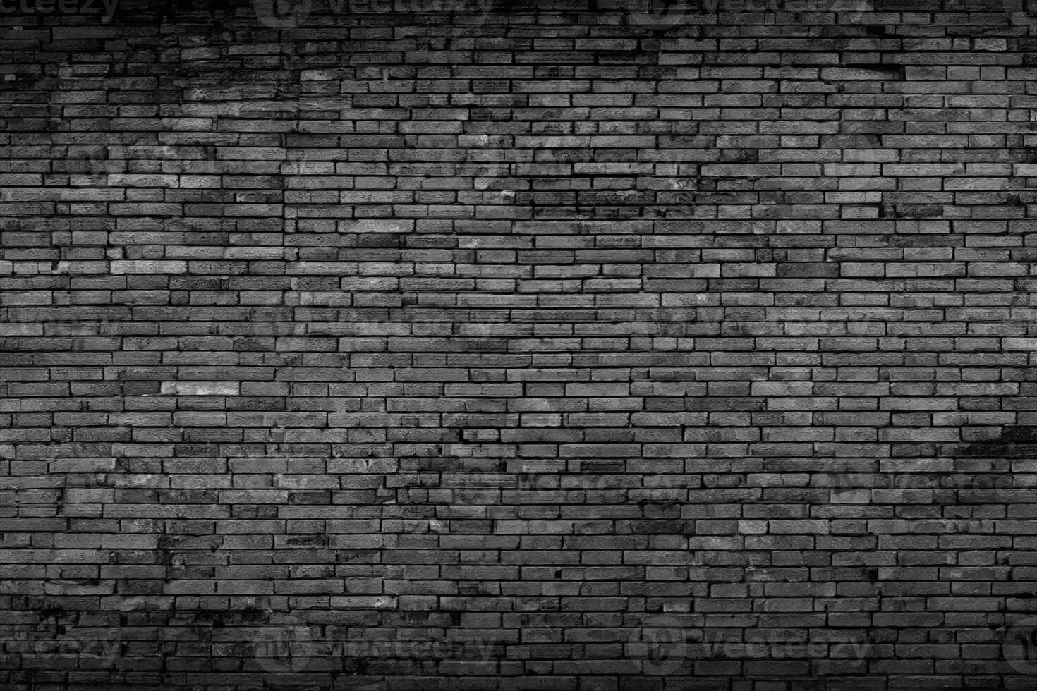 Black brick walls that are not plastered background and texture. The texture of the brick is black. Background of empty brick basement wall. photo