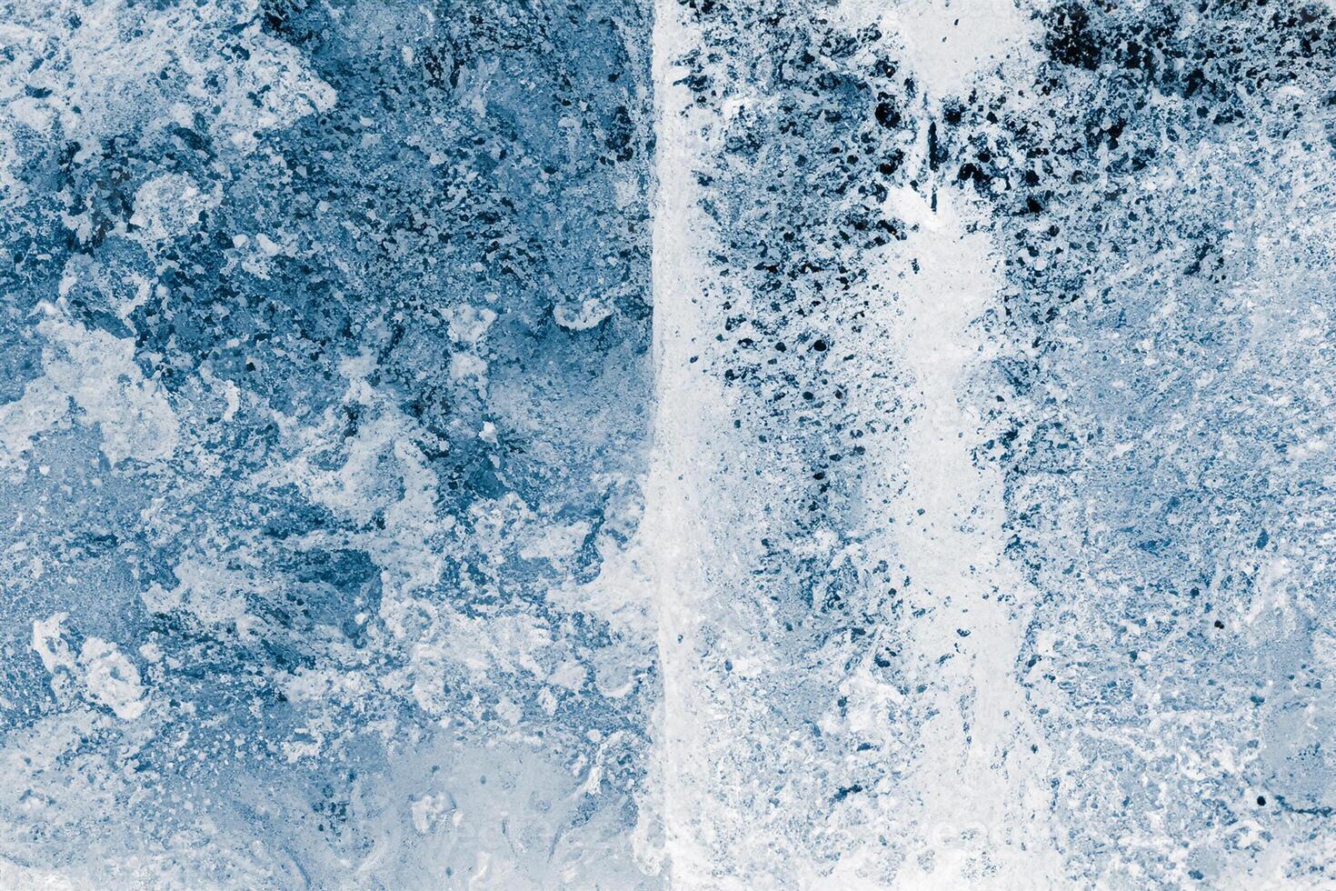 Ice blocks surface, blue toned. Ice texture background. Textured cold frosty surface of ice blocks. photo