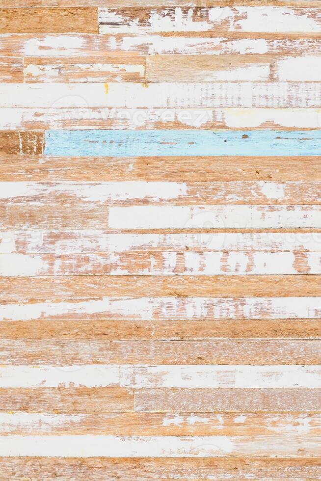 The background of weathered painted wood. Old scratched wooden planks with some cracks. Grunge rusty wood texture background of old dirt scratched wooden planks. Vertical. photo