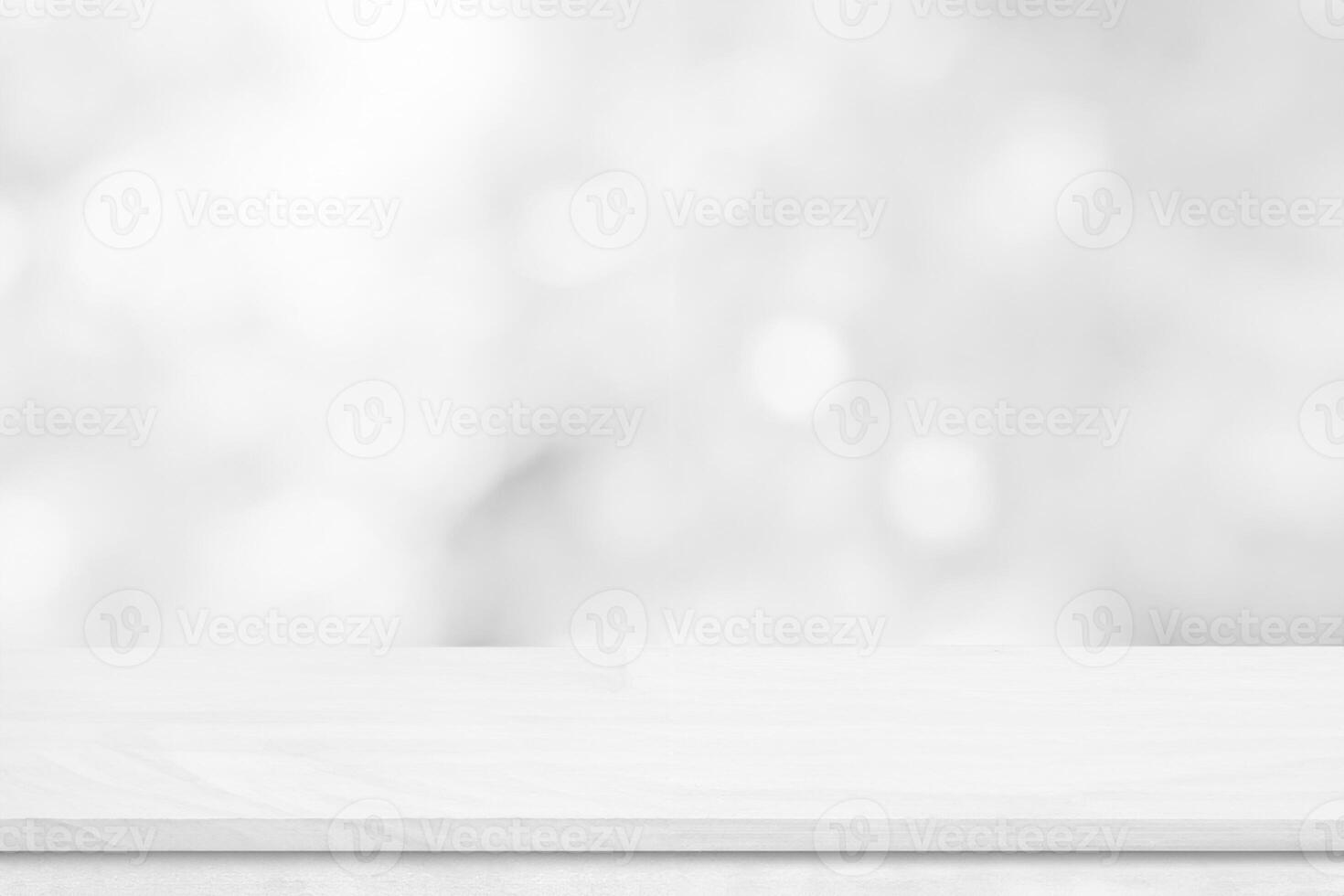 White wood tabletop over blur white bokeh light background. Empty wood shelf for product display, banner or mockup. photo