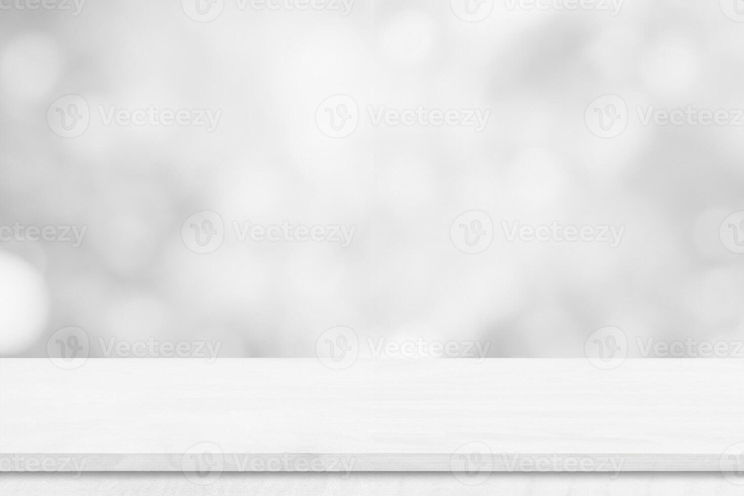 White wood tabletop over blur white bokeh light background. Empty wood shelf for product display, banner or mockup. photo