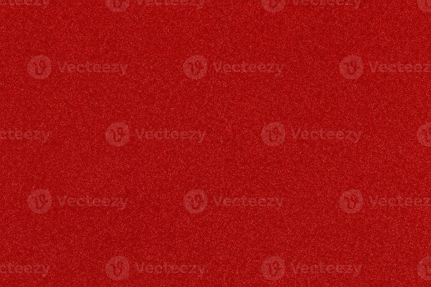 red Christmas background with shiny color speckles photo