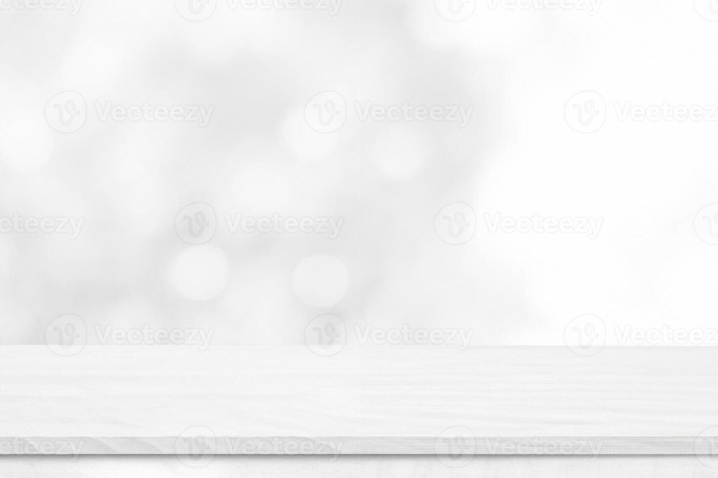 White wood tabletop over blur white bokeh light background. Empty wood shelf for product display, banner or mockup. photo