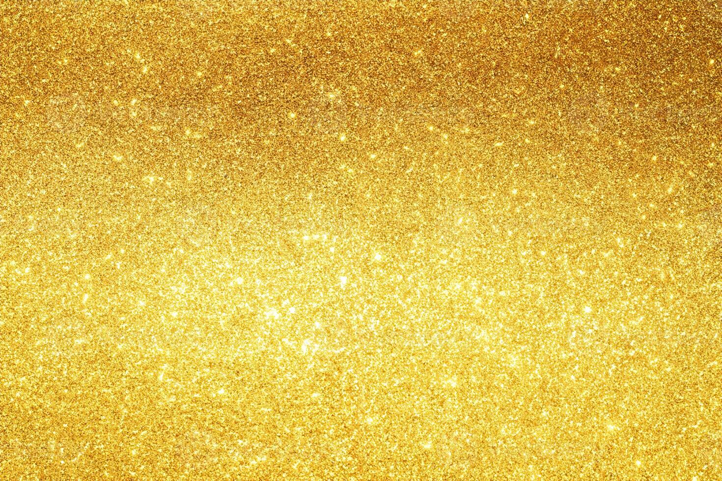 gold Sparkling Lights Festive background with texture. Abstract Christmas twinkled bright bokeh defocused and Falling stars. Winter Card or invitation photo