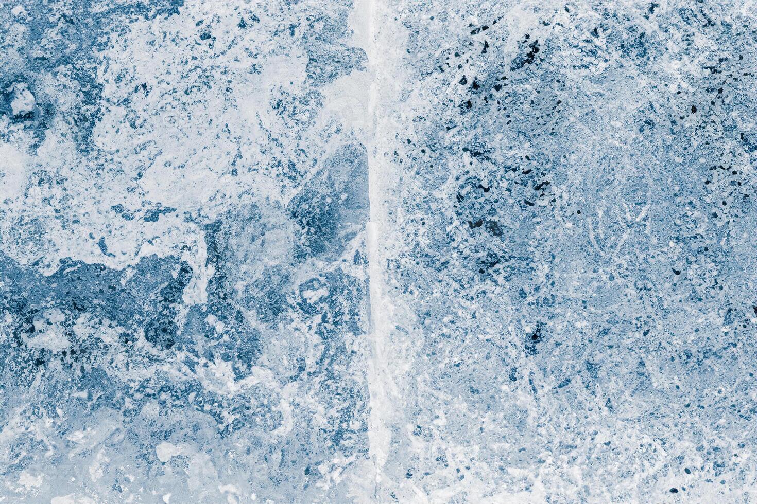 Ice blocks surface, blue toned. Ice texture background. Textured cold frosty surface of ice blocks. photo
