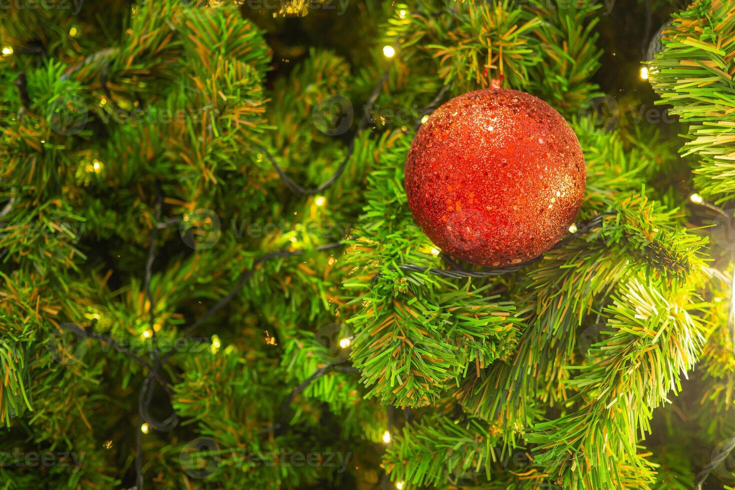 Bright and abstract blurred colorful on Christmas tree with shimmering glitter, defocused background photo