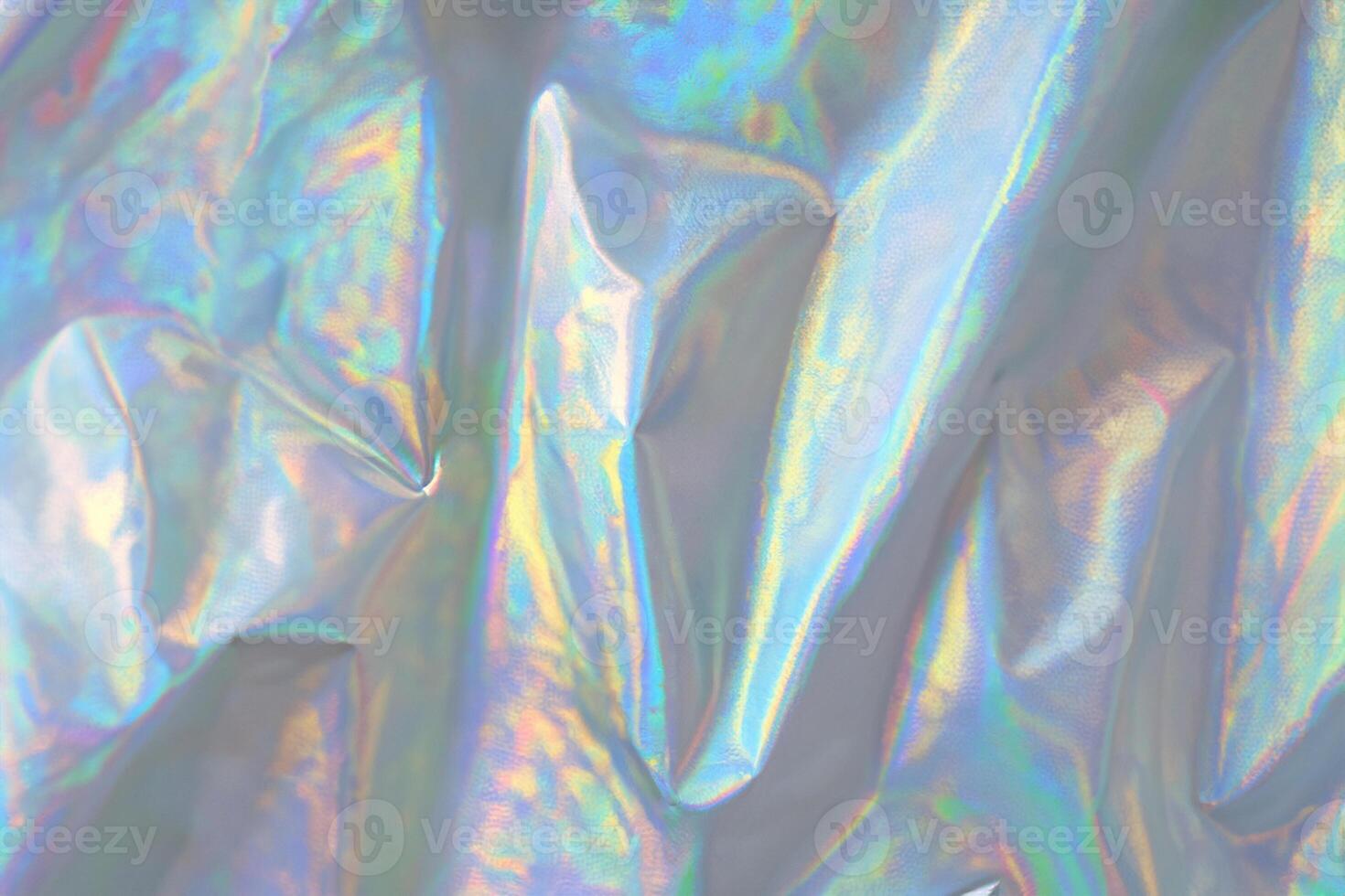 trendy holographic background.Silver metallic iridescent background.pastel colored  holographic texture in pink violet, Silver and  green colors.colorful chrome fabric.I photo