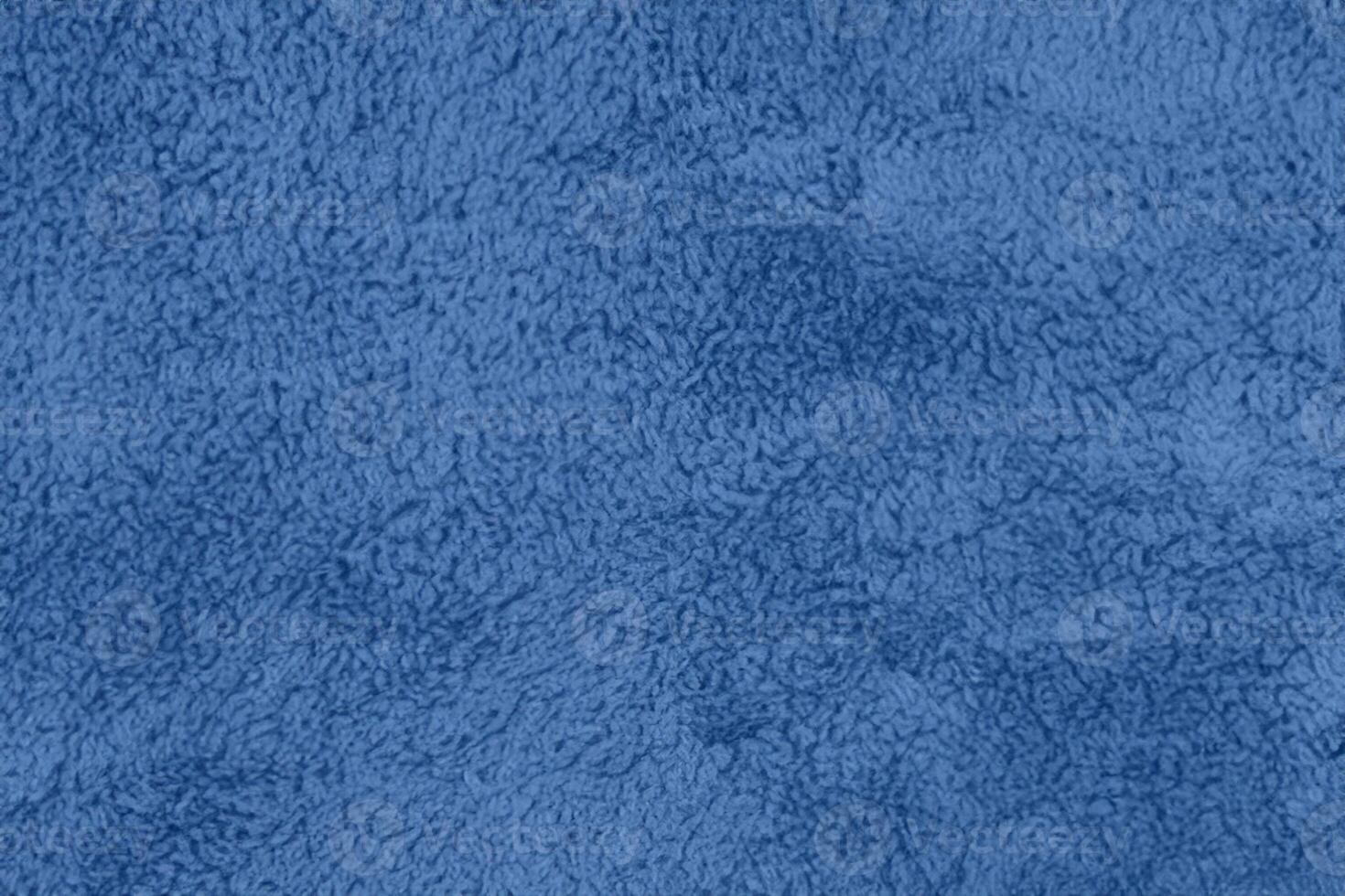 Blue sherpa textured plush fabric material background photo