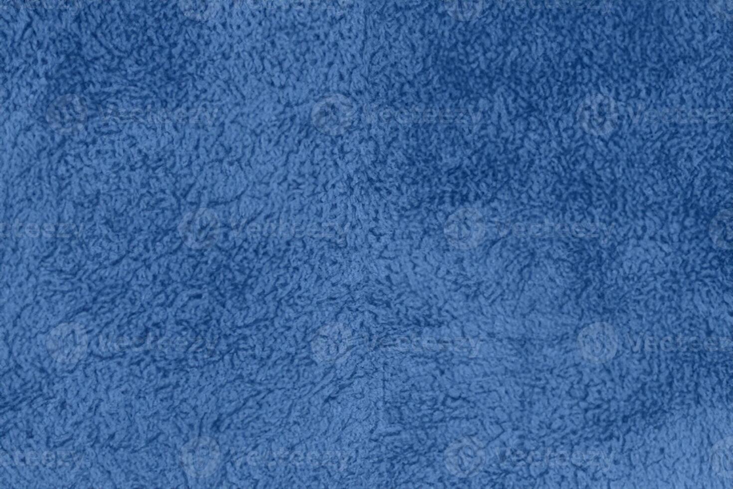 Blue sherpa textured plush fabric material background photo