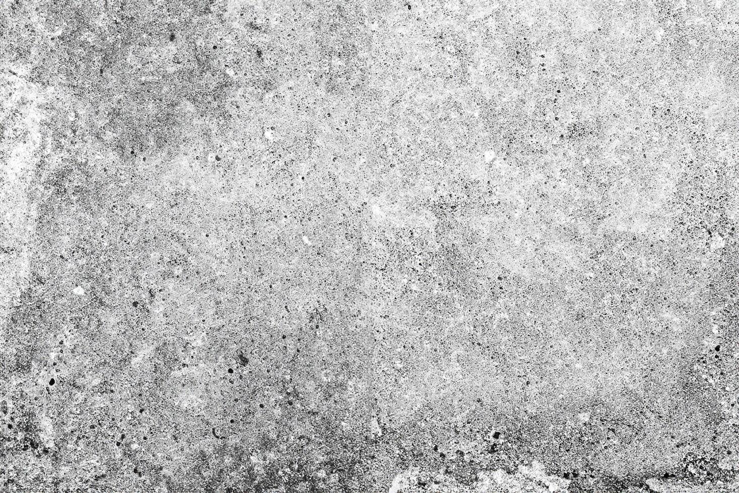 Texture of a concrete wall with cracks and scratches which can be used as a background photo