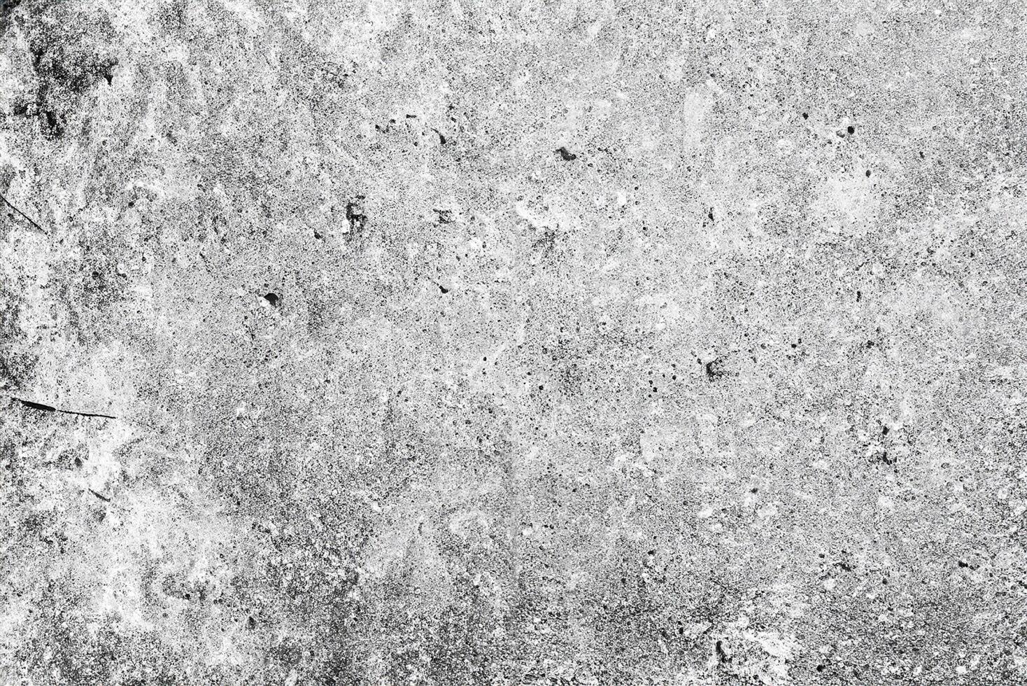 Texture of a concrete wall with cracks and scratches which can be used as a background photo