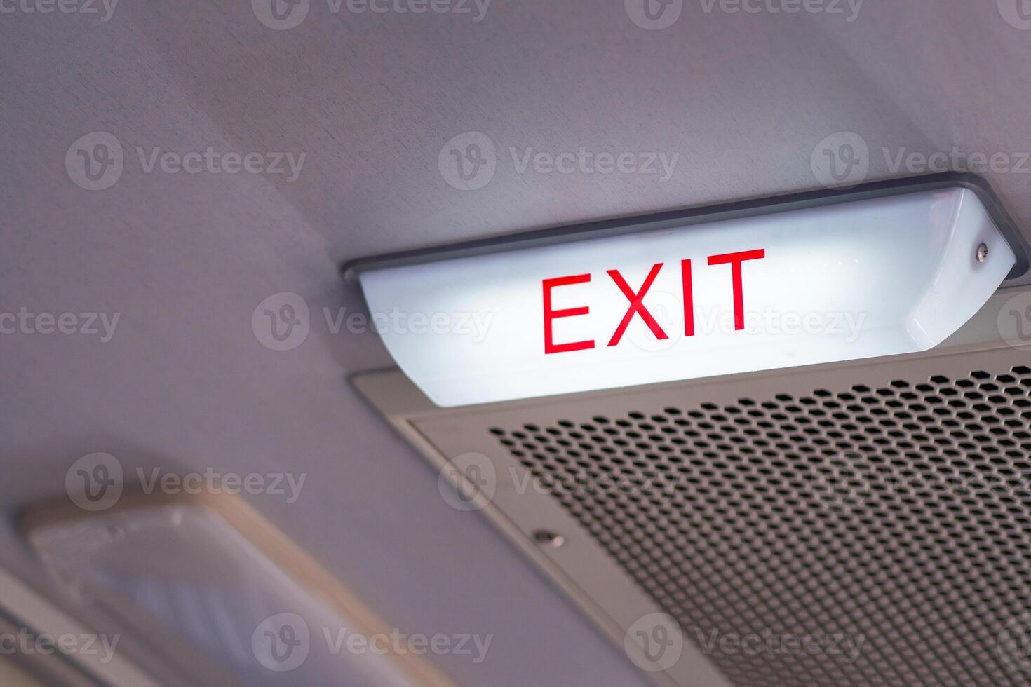 Close-up of exit sign safety on the bus with space for text photo